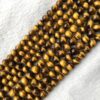 Shop 6mm Natural Tiger Eye Smooth Round Beads