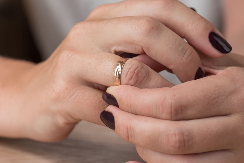 Any ideas on how to get this ring off my wife's swollen finger? Or best way  to cut it off the least painful way? Its swelled because we've been trying  to get