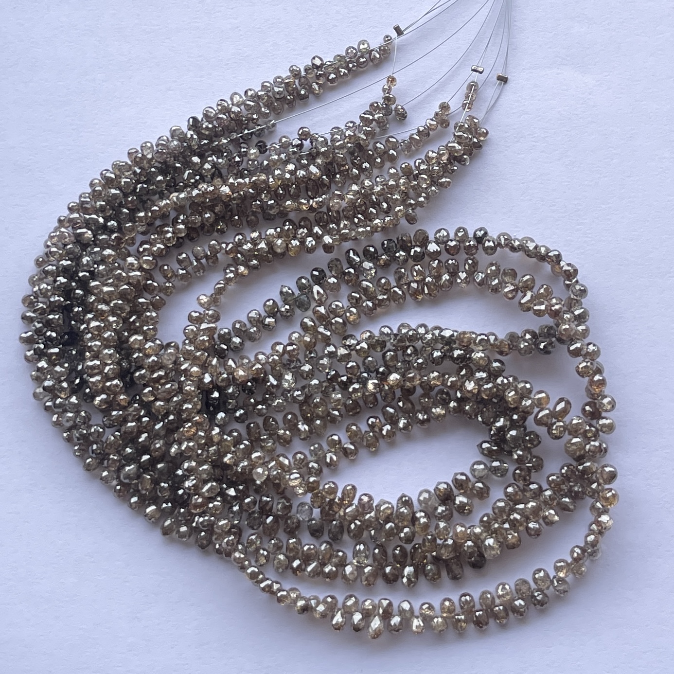 Shop 3mm 5mm Natural Brown Champagne Color Diamond Faceted Drops Briolette Beads Strand Shop 3mm 5mm Natural Brown Champagne Color Diamond Faceted Drops Briolette Beads Strand